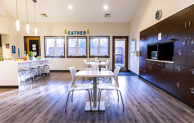 Kitchen with shared cooking and dining spaces.