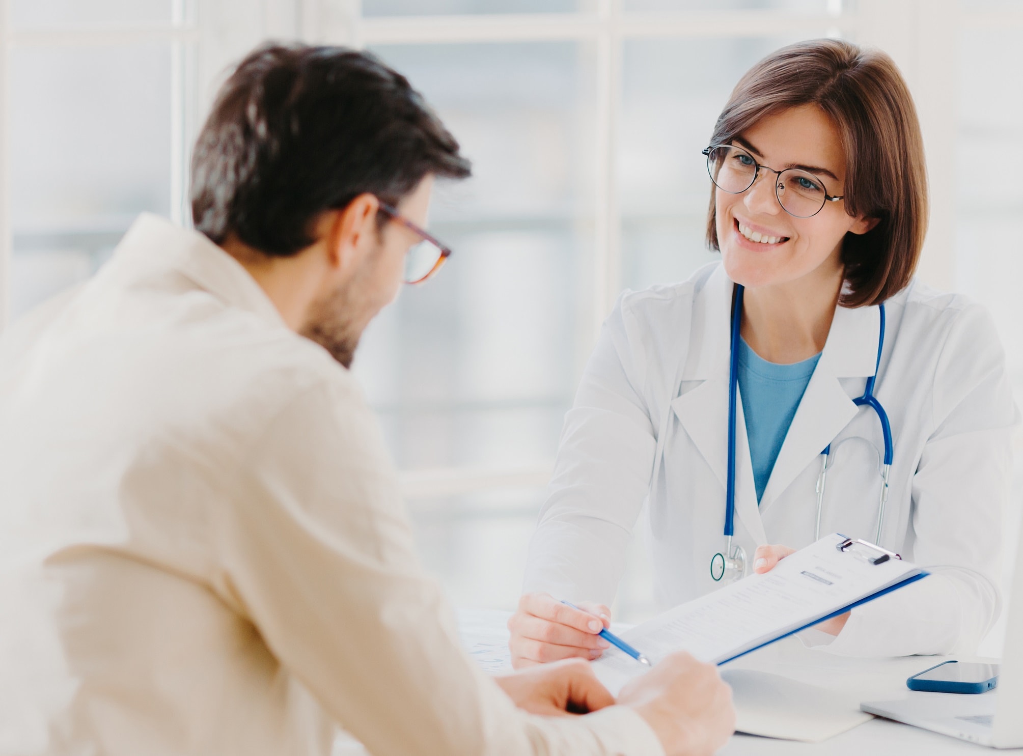 doctor talking with patient