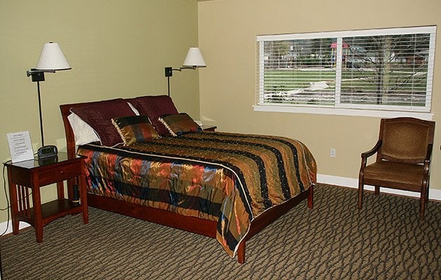 Bed room with window looking out to playground